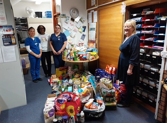 Staff members with the donations